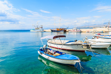 Naklejka na ściany i meble Typical fishing boats in Postira port, Brac island, Croatia