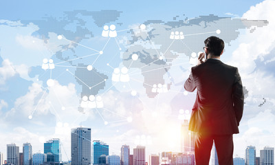 Concept of business success and control with confident boss against cityscape background