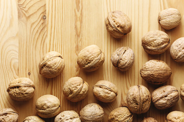 Walnuts on a wood background