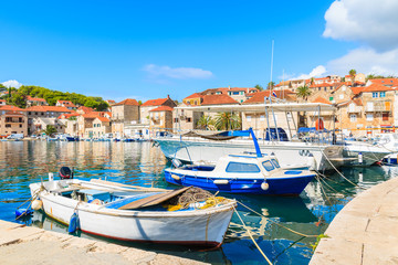 Fototapeta na wymiar Fishing boats in Milna port on sunny summer day, Brac island, Croatia