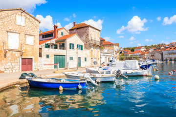 Fototapeta na wymiar View of Milna port with colorful fishing boats and houses, Brac island, Croatia