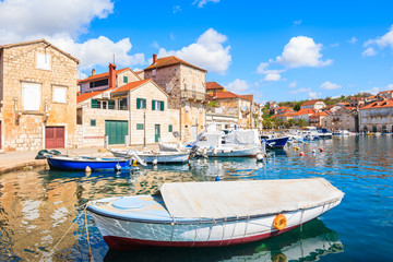 View of Milna port with colorful fishing boats and houses, Brac island, Croatia