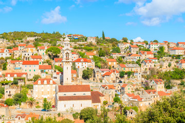 Fototapeta premium View of Lozisca village with colorful houses and church, Brac island, Croatia