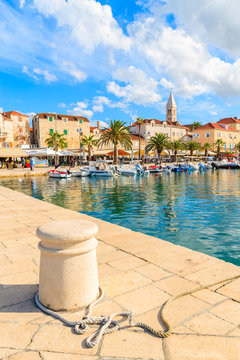 Pier in Supetar port with colorful houses and boats, Brac island, Croatia