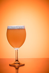 Bottle of beer and glass full foam condensate cold refreshing