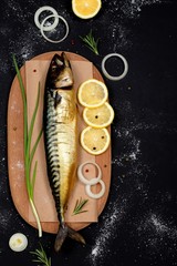 Smoked mackerel on a cutting board top view