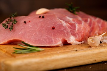 Raw meat slices on the board