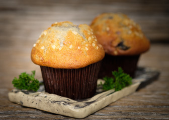 Still life blueberry muffins in a rustic style.