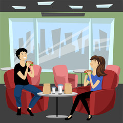 guy and girl eating in a cafe