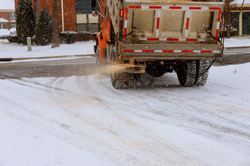 municipal car for sprinkle half the salt and sand on roads with snow machine for sprinkling sand...