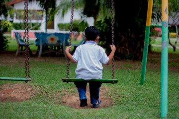 Kid swing seat in the garden
