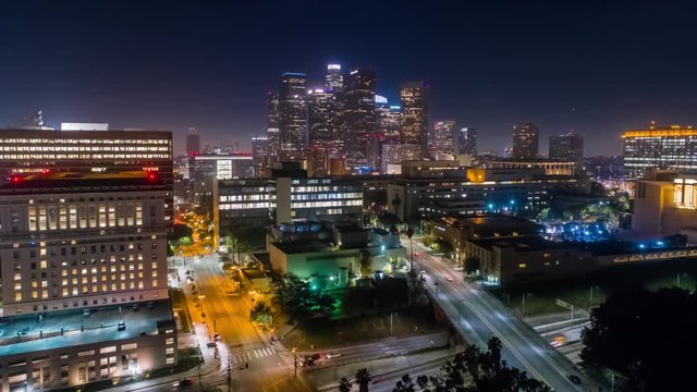 Cinematic urban aerial time lapse view of downtown Los Angeles at night