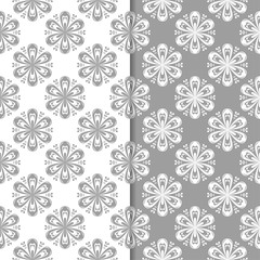 White and gray floral ornaments. Set of seamless backgrounds