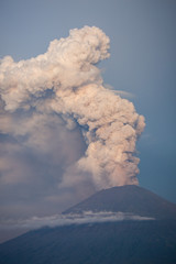 Naklejka premium Mount Agung volcano erupting in Bali Indonesia. 