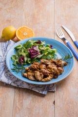 sliced chicken legs marinated with lemon and orange juce