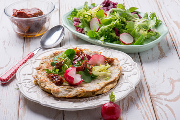chapati bread with mixed salad and dried tomatoes