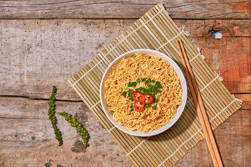 instant noodle in bowl cooked spicy taste topping with eggs