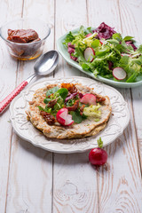 chapati bread with mixed salad and dried tomatoes