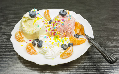 A plate with a frosty dessert.