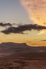 Fototapeta na wymiar Vertical photo amazing landscape of yellow sunrise in negev desert israel.