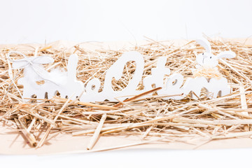 Congratulation Happy Easter in German. Decorated letters isolated in straw