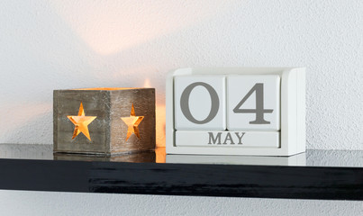 White block calendar present date 4 and month May