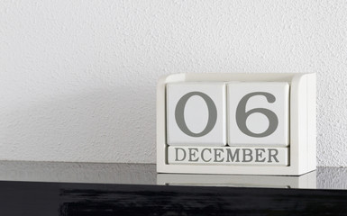 White block calendar present date 6 and month December