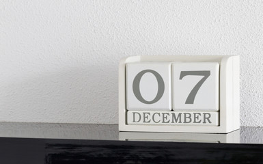White block calendar present date 7 and month December