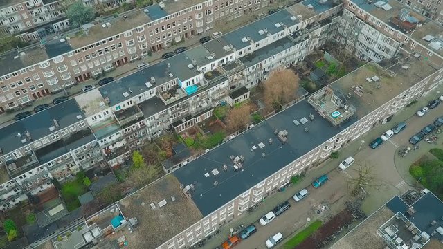 Aerial down view to apartment buildings and inner gardens and courtyards in Amsterdam, Netherlands
