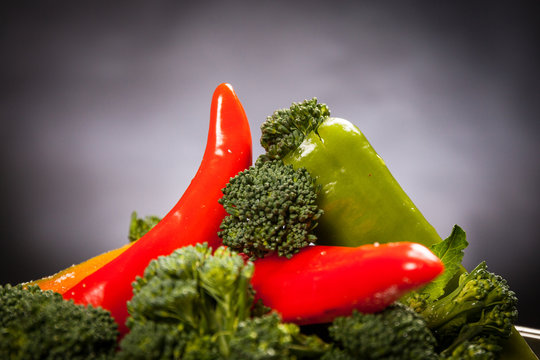 Sexy food: red hot pepper with broccoli. Mischievous affinity with penis