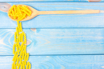 Pasta on wooden background. Diet and food concept.