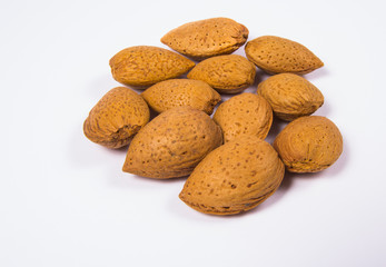 Almonds in a shell isolated on white background.