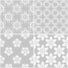 Fototapeta premium Floral patterns. Set of gray and white seamless backgrounds