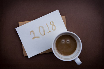 Obraz na płótnie Canvas Happy New Year greeting with coffee draw in 2018