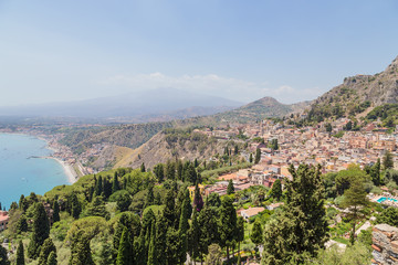 Taormina, Sicily. Scenic view of the city of the Ionian coast. In the background, Mount Etna
