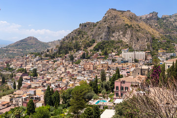 Fototapeta na wymiar Taormina, Sicily. Scenic view of the city on the mountainside