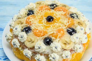 cake with oranges on a light wooden background