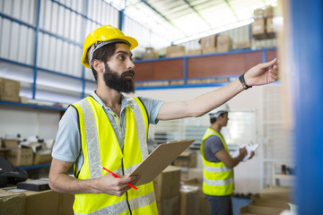 Warehouse worker checking stock products