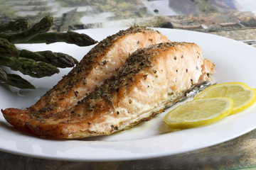 Prepared salmon with asparagus on a plate