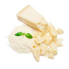 a piece of Parmesan and grated cheese on white background