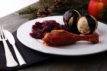 Crusty Christmas goose leg with braised red cabbage and dumplings