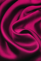fuchsia silk with waves of fabric, background 
