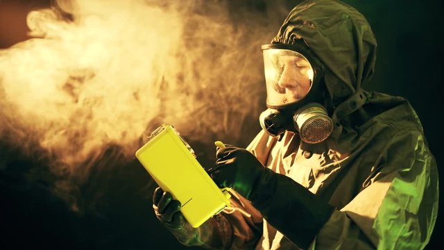 prepper or researcher in a hazmat suite checking for radioactivity 4k