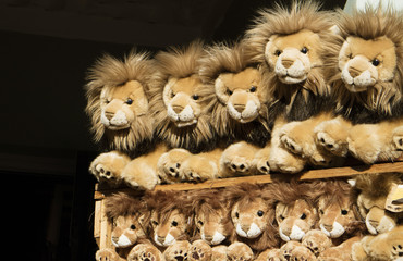 Toy lions on display in a children's shop
