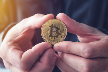 Man showing Bitcoin