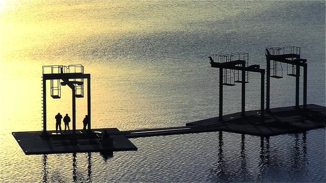 Workers in water intake in lake