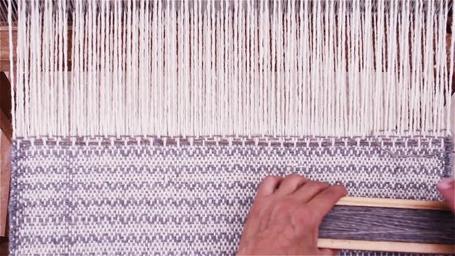 Woman making a loom, tradition of the South American Altiplano