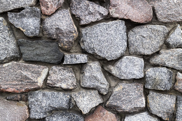 Rubble grey and brown stone wall, rubble work