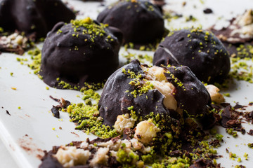 Chocolate Covered Chestnut Dessert with Pistachio Powder. / Kestane Sekeri