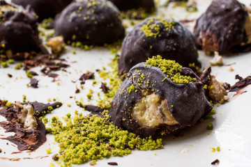 Chocolate Covered Chestnut Dessert with Pistachio Powder. / Kestane Sekeri